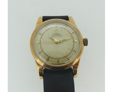 A vintage 14ct gold cased Omega Automatic Chronometer gentleman?s Wristwatch, the silver dial with raised baton markers, gilt