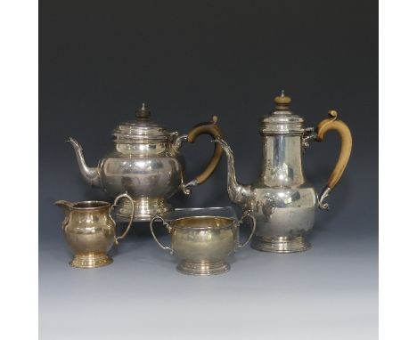 An Elizabeth II silver four piece Tea Set, by Garrard and Co., hallmarked London, 1975, of circular form, the teapot and hot 