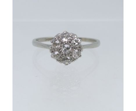 A diamond cluster Ring,&nbsp;the central old cut stone surrounded by six further old cut stones, all approx. 0.035ct, all mou