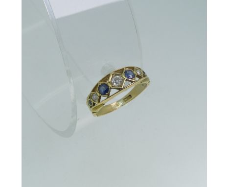 A graduated seven stone sapphire and diamond Ring, the central diamond approx. 0.1ct, all mounted in unmarked yellow gold, te