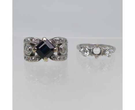 A diamond Ring, now with two outer stones only, the centre stone missing, approx total diamond weight 0.38ct, all mounted in 