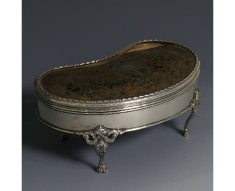 A George V silver Jewellery Casket,&nbsp;by&nbsp;William Comyns &amp; Sons, hallmarked London, 1911, of kidney shape raised o