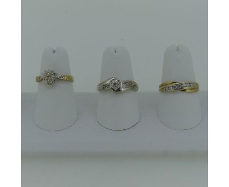 A 9ct yellow gold Ring, channel set with seven small diamonds, Size O, 2.4g, together with a small 9ct white gold ring set sm