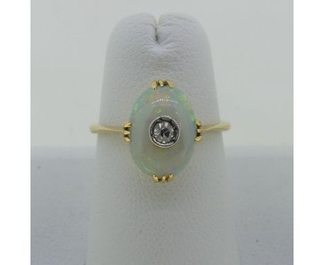 A small opal and diamond Ring,&nbsp;the oval opal 10.5mm x 7.5mm, set with a diamond point centre, all mounted in 18ct yellow