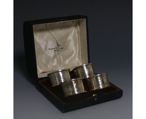 A cased set of four George V silver Napkin Rings, by&nbsp;Walker &amp; Hall, hallmarked Sheffield, 1927/8, of circular form w
