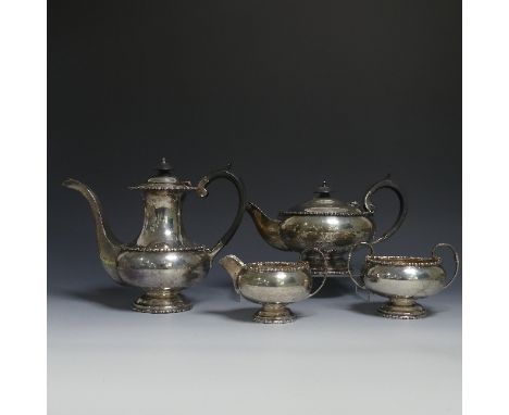 A George VI silver four piece Tea and Coffee Set, by&nbsp;Walker &amp; Hall, hallmarked Sheffield, 1947/8, of circular form w