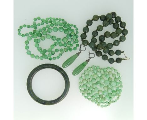 A quantity of Jade and green stone Jewellery, including three circular bead necklaces, a pair of silver mounted drop earrings