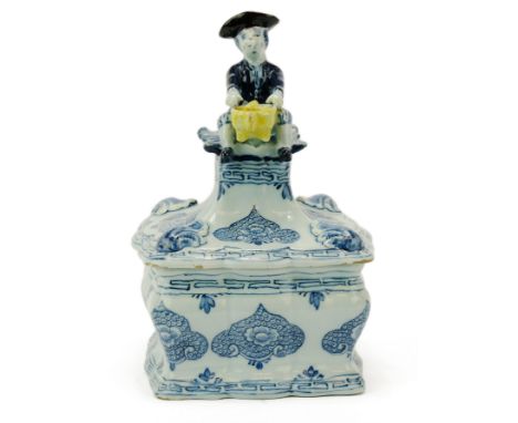 A Delft pottery tobacco jar,18th century, Netherlands,Of a square lobed bombé form, decorated in blue with floral cartouches 