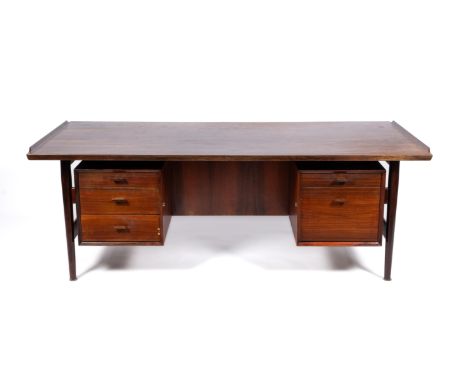 Arne Vodder (1926-2009) for Sibast,A model 207 rosewood desk, 1960s, Denmark,The rectangular top with upward curving edges to