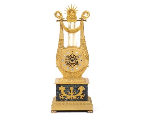 A Restauration ormolu and marble lyre mantel clock,First quarter 19th century, France,The lyre above a vert-de-mer marble bas