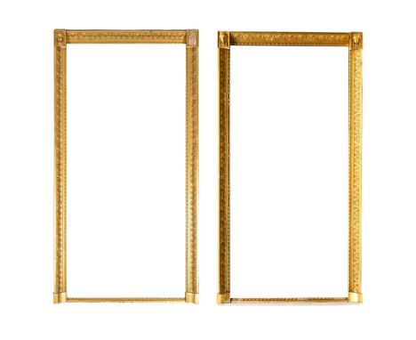 A large pair of Empire giltwood overmantel mirrors,First quarter 19th century,Each with two mirror plates within a rectangula