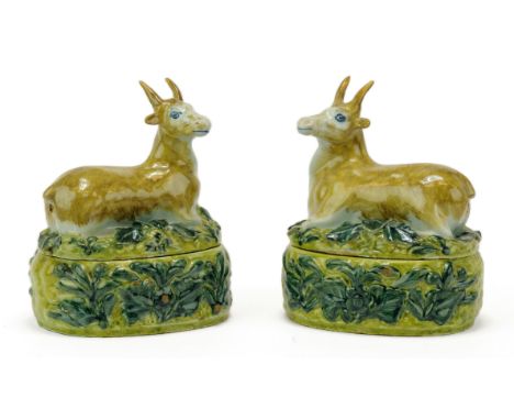 A pair of Delft polychrome pottery butter dishes,Ca. 1760, Netherlands,A rare pair,with recumbent deer covers. Marked with an