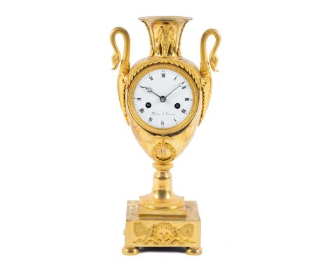 An Empire ormolu vase mantel clock,First quarter 19th century, France,The vase-shaped case decorated with putti, swan's heads