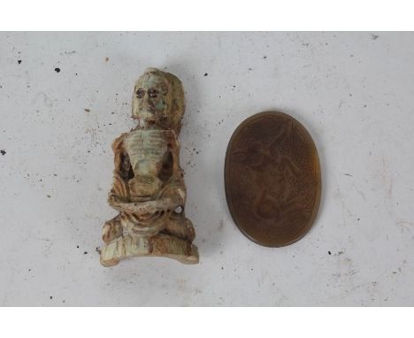 Chinese hardstone seal, carved in relief with an animal, 6.5cm wide, together with a carved figure, 9.5cm high (2)