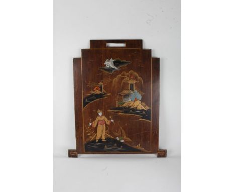 Chinese walnut veneered and chinoiserie firescreen, depicting a figure and pagodas to the background, 71cm high x 61.5cm wide