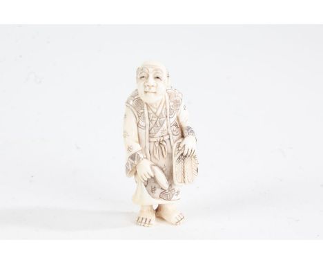 Japanese Meiji period carved ivory netsuke, in the form of a standing gentleman, character mark to base, 5cm high