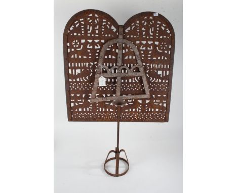 Eastern rustic metal lamp screen, with pierced screen and hanging lamp raised on a circular base, 88cm high