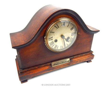 An early 20th century mantle clock bearing presentation plaque "Presented to Ex. P.C. Charles Ramsey by the officers and men 