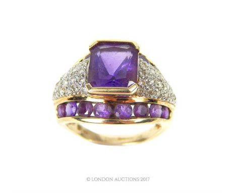 A 9 ct yellow gold amethyst and diamond bombe dress ring, centrally set with a rectangular, princess cut amethyst, flanked by