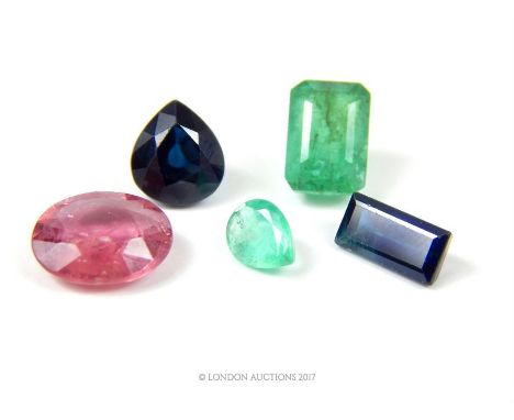 Loose gemstones, comprising a step cut emerald, 9 x 6 mm, a pear cut emerald, a pear cut sapphire, a baguette cut sapphire an