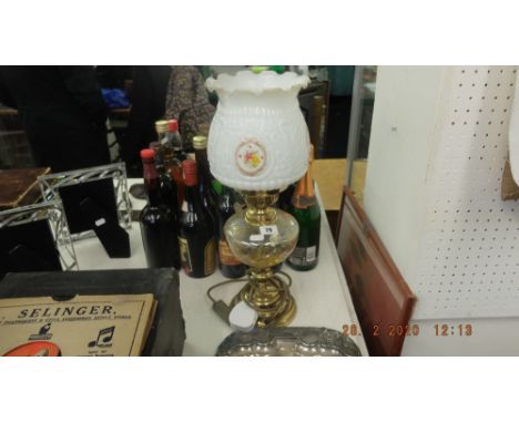 A converted brass and glass oil lamp