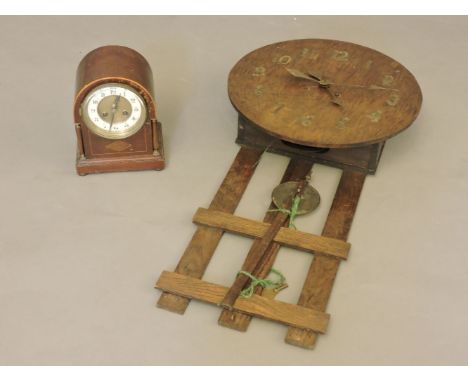 An Arts and Crafts style wall clock, and an Edwardian two train mantel clock