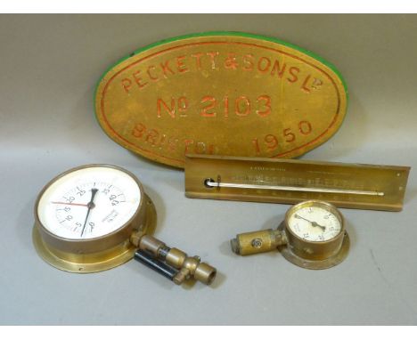 An oval brass locomotive plaque, 'Peckett and Son Ltd, no 2103, Bristol 1950', 39 x 22cm, two steam valves, and a brass therm