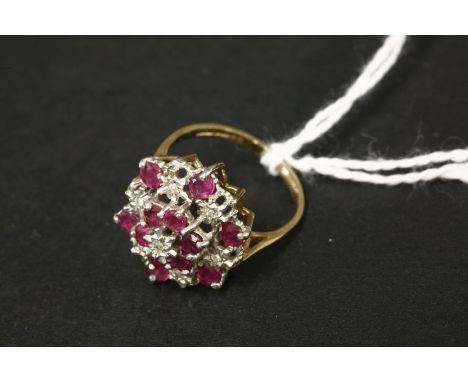 A 9ct gold diamond and ruby cluster ring