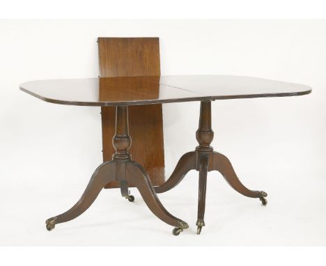 A mahogany twin pillar dining table, with a solid top, 239cm long, 100cm wide