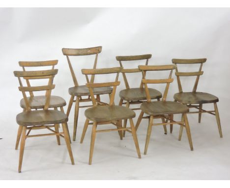 Seven Ercol child's chairs, with a red badge, mid size