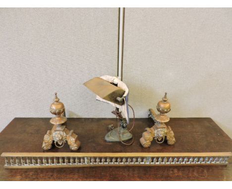 Brass firedogs and a fender, in the Chinese style, and an Edwardian desk lamp