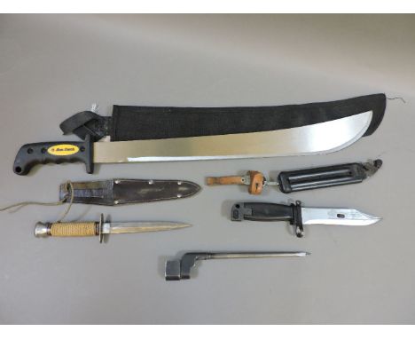 An Am-tech machete, an Enfield Spike bayonet, a modern bayonet, and a Commando knife in leather scabbard