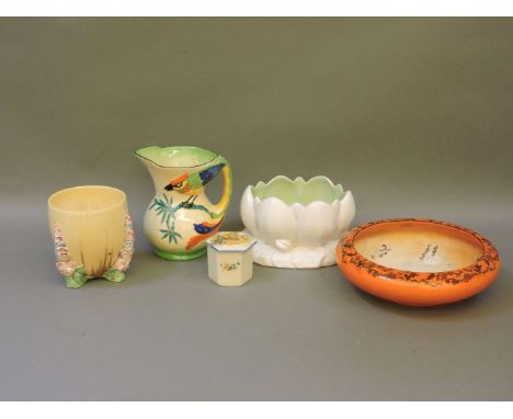 A Clarice Cliff yellow vase, damaged, a Clarice Cliff water lily vase, a 'Tropical' design jug, a vintage orange bowl with Ja