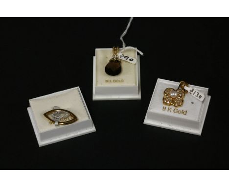 A 9ct gold smokey quartz briolette and diamond pendant, a 9ct gold marquise shaped diamond pendant, and a 9ct gold cultured p