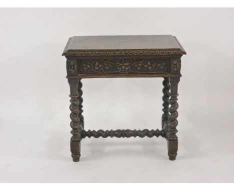 A late Victorian carved oak side table, with single drawer, on barley twist legs, 76cm wide, 56cm deep