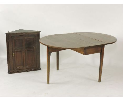 A small oak wall mounted corner cupboard, and a 19th century oak drop leaf table