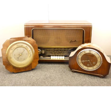 A Bush Value radio, type VH764, a 1920s walnut mantel clock, and a wall mounted barometer