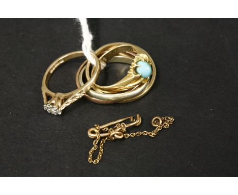 A 9ct gold single stone diamond ring, an 18ct gold single stone turquoise ring, and a 9ct gold Russian wedding ring