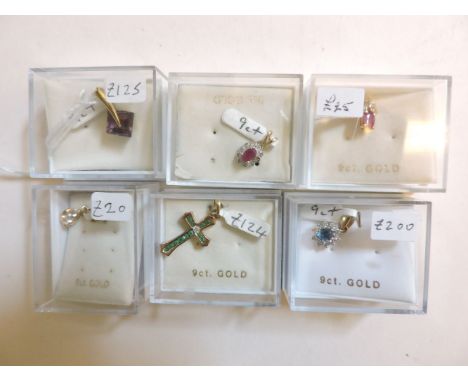 A 9ct gold emerald and diamond cluster pendant, a 9ct gold ruby and diamond cluster pendant, a 9ct gold diamond and emerald c