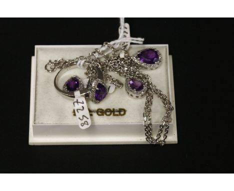 A 9ct white gold pear shaped amethyst and diamond cluster pendant, earring and ring suite