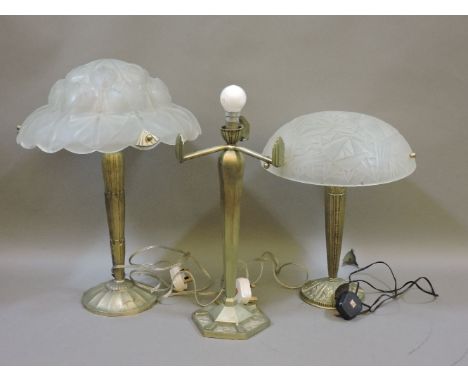 Two brass Art Nouveau style table lamps, wtih clear glass shades, and an Art Deco style table lamp, no shade