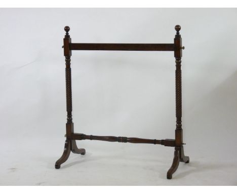 A 19th century mahogany carpet stand, on twist turned supports, 121cm high