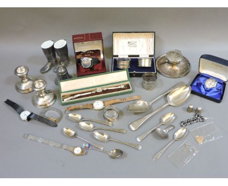 A quantity of silver items, to include an inkwell, napkin rings, spoons, dwarf candlesticks, and various wristwatches