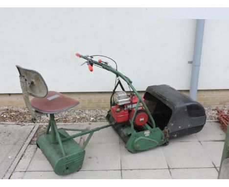 A Webb cylinder mower, with ride on seat and roller