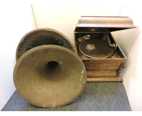 A Columbia oak cased table gramophone, a painted tin horn, and a brass horn