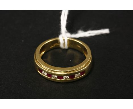 An 18ct gold ruby and diamond half hoop ring