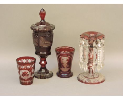 Bohemian red glassware, including a table lustre, and a lidded goblet