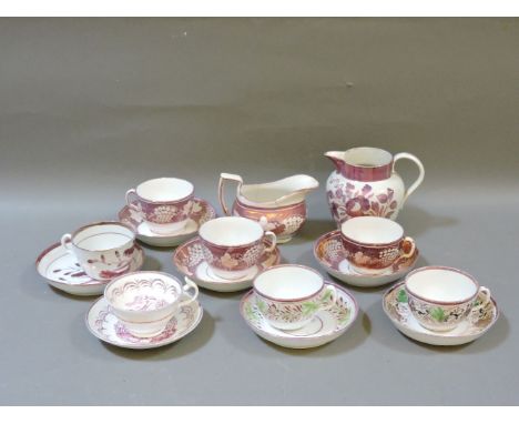 A small collection of 19th century copper lustre ware, seven cups and saucers, two jugs, green wine glasses, nine with clear 