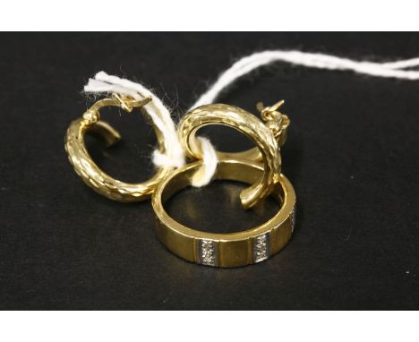 A pair of gold coiled hoop earrings, marked 750, and a nine stone diamond ring marked 18k