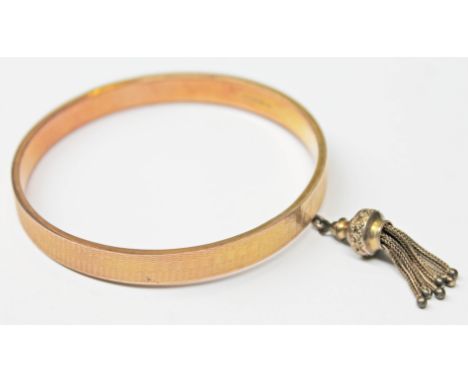 A 9ct gold bangle, diam. 7cm, wt. 14.9g.